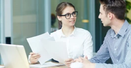 Close-up illustration of a W2 tax form with explanations highlighting sections for employees